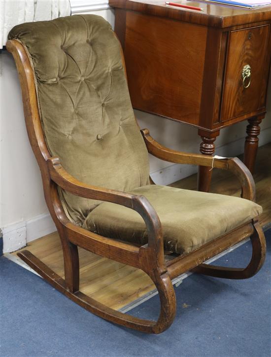 A late Victorian mahogany rocking armchair